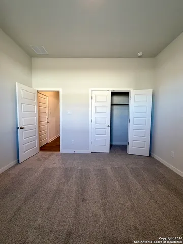 a kitchen with stainless steel appliances a refrigerator and wooden floor