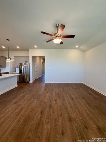 a view of an empty room with windows