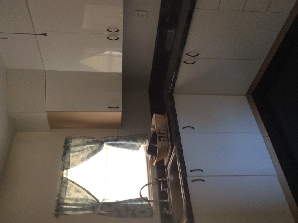 608 South Bell Street Big Spring, TX 79720 - Photo 8 of 11 a close view of sink and cabinets