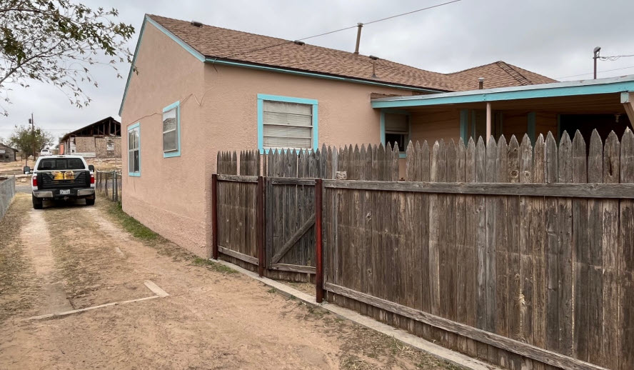 608 South Bell Street Big Spring, TX 79720 - Photo 10 of 11 a front view of a house with wooden fence