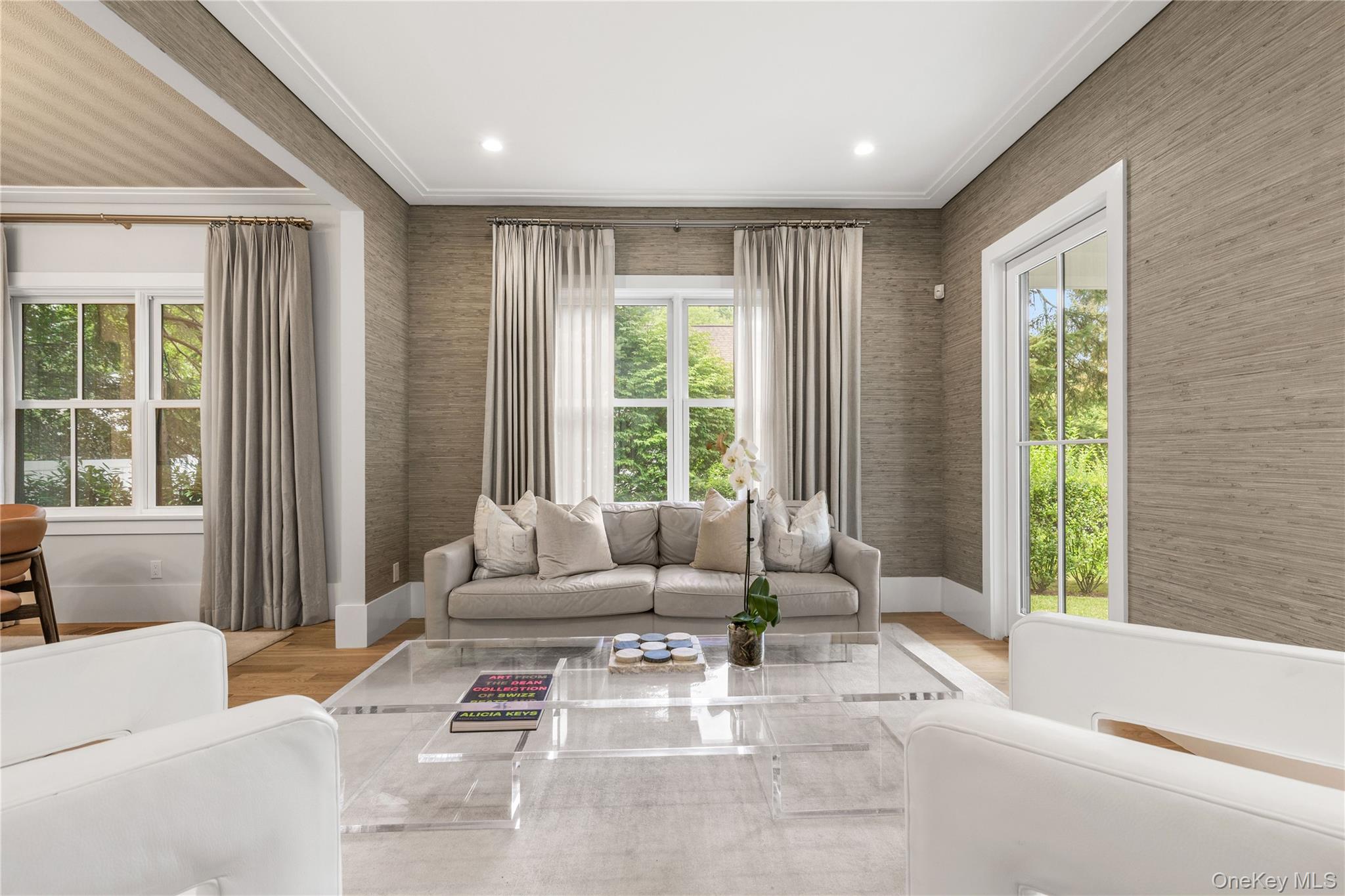 Oversized windows and french doors bring light in all day