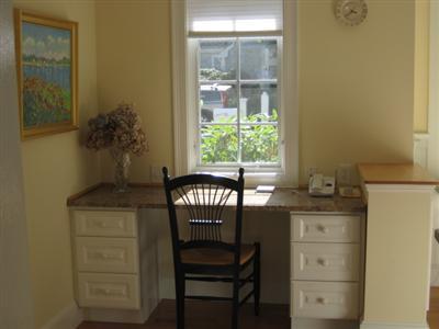 130 Parker Road, Unit B Osterville, MA 02655 - Photo 8 of 13 a room with a table and chair