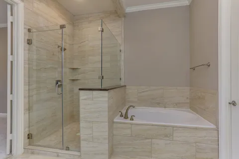 an empty room with a window and a mirror