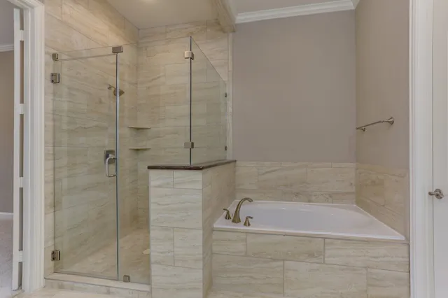 a bath tub sitting next to a shower