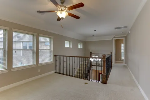a view of livingroom with hardwood floor and ceiling fan