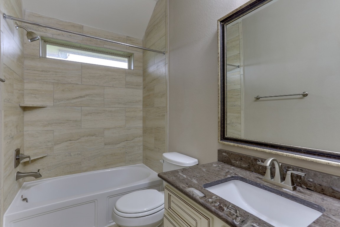 3 Herons Flight Place Spring, TX 77389 - Photo 22 of 27 a bathroom with a granite countertop sink toilet a mirror and shower