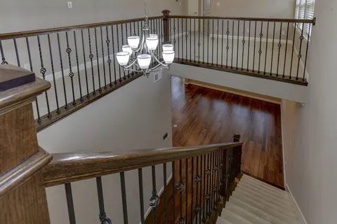 a view of balcony with wooden floor