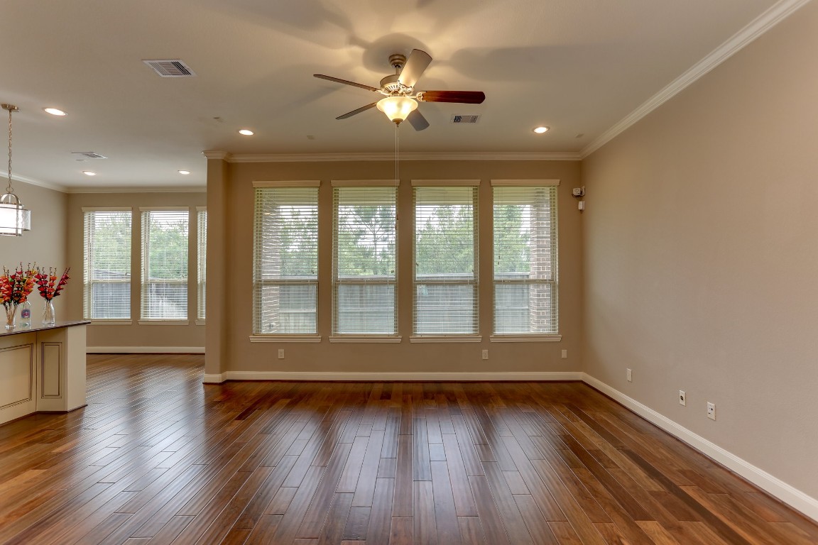 3 Herons Flight Place Spring, TX 77389 - Photo 7 of 27 wooden floor in an empty room with a window