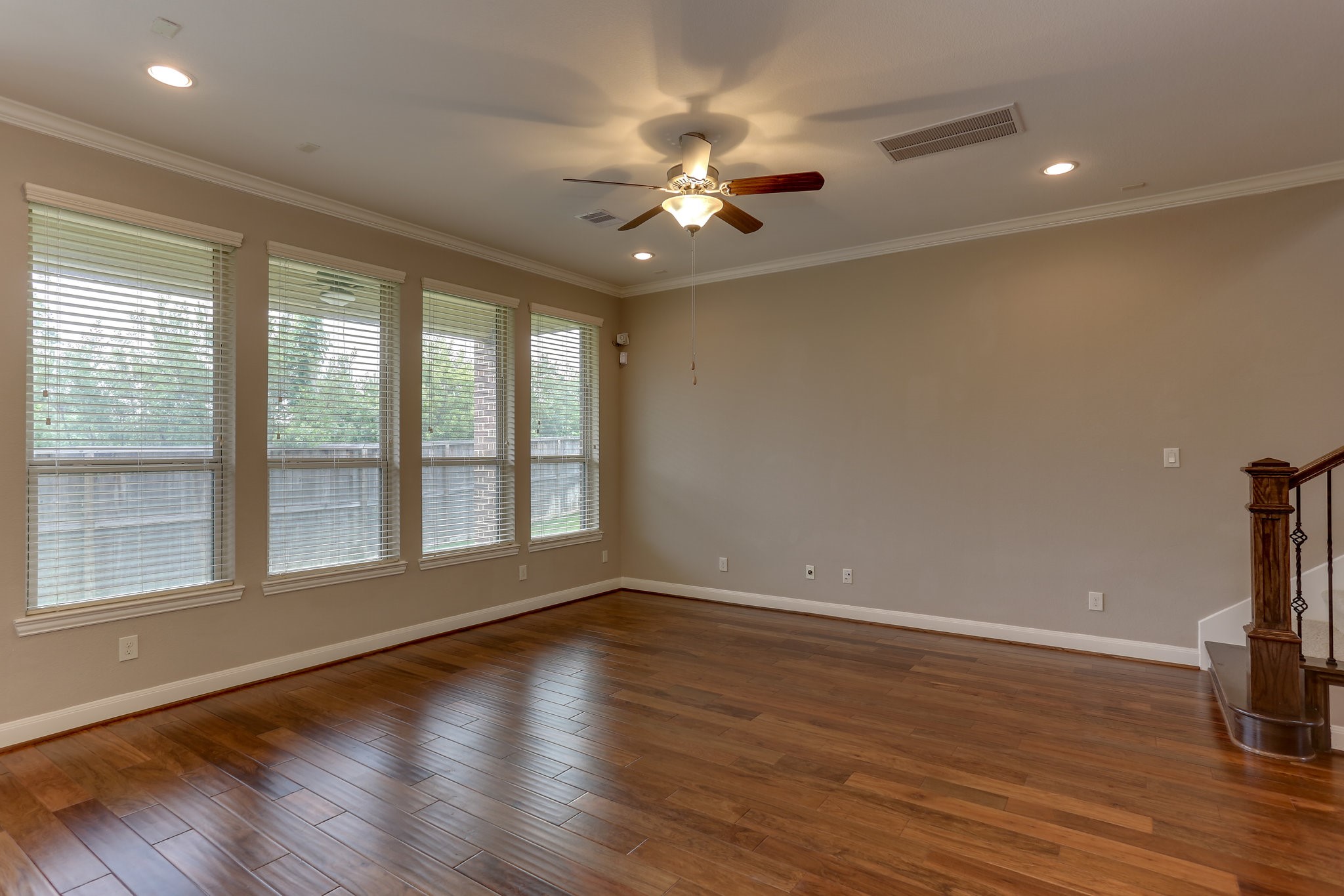 3 Herons Flight Place Spring, TX 77389 - Photo 8 of 27 a view of an empty room with wooden floor and a window