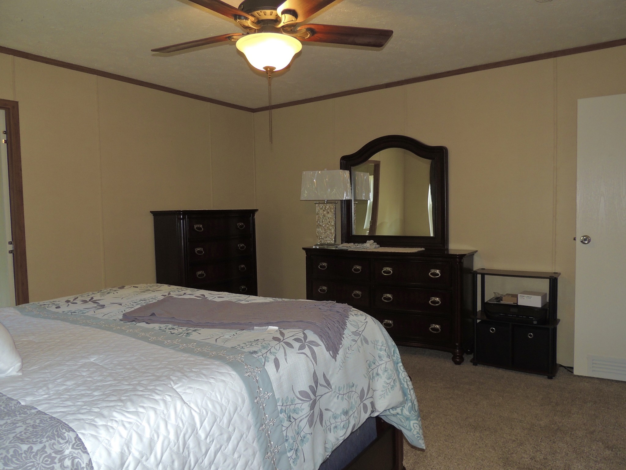922 Arlington Ridge Road Erin, TN 37061 - Photo 14 of 18 a bedroom with a bed and a dresser