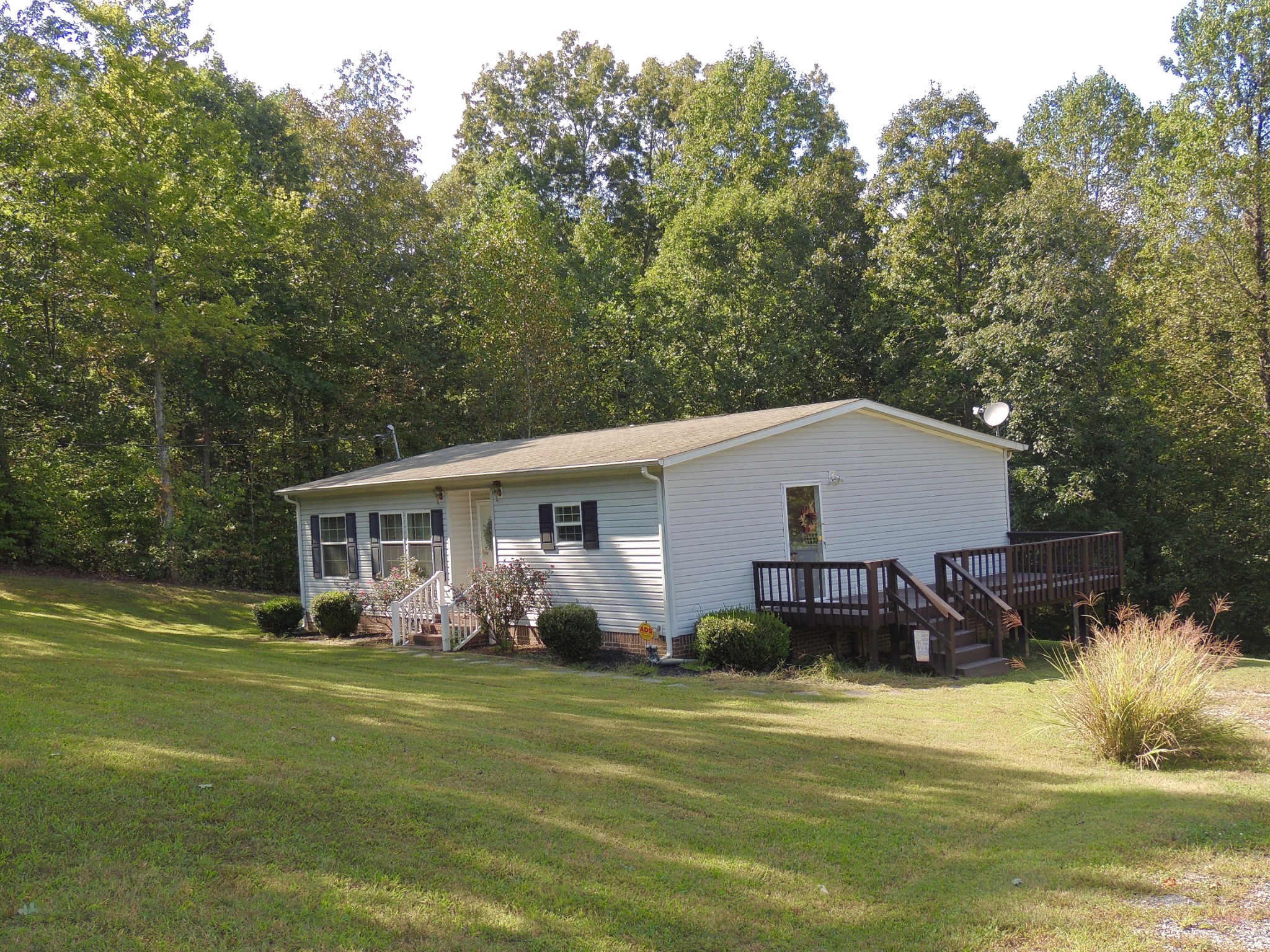 922 Arlington Ridge Road Erin, TN 37061 - Photo 2 of 18 a view of a house with a backyard