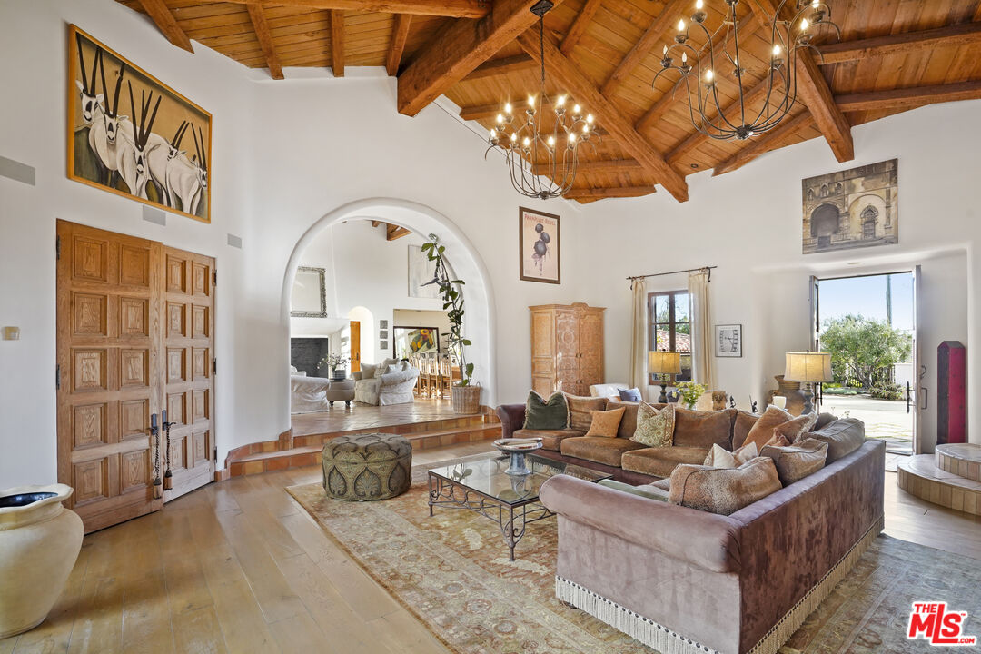 7332 Birdview Avenue Malibu, CA 90265 - Photo 12 of 71 a living room with fireplace furniture and a large window