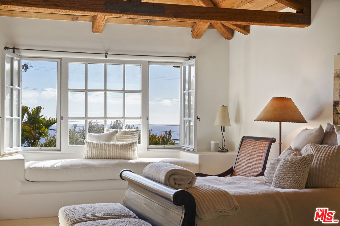 7332 Birdview Avenue Malibu, CA 90265 - Photo 17 of 71 a living room with furniture and a large window