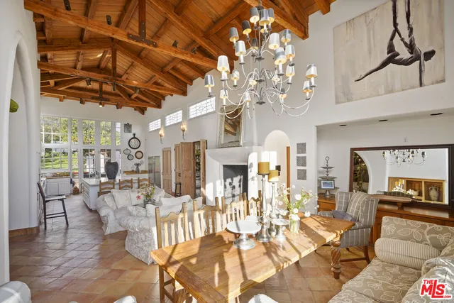 a living room with lots of furniture and a chandelier