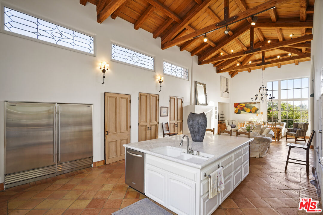 7332 Birdview Avenue Malibu, CA 90265 - Photo 24 of 71 a living room with stainless steel appliances granite countertop a stove and a refrigerator