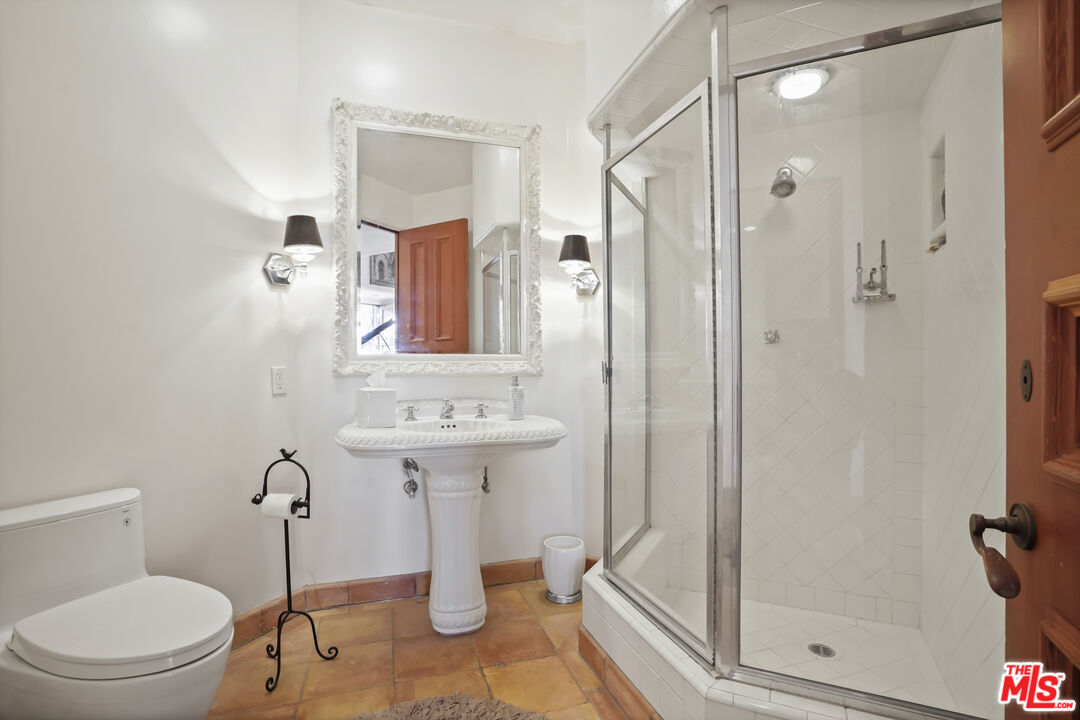7332 Birdview Avenue Malibu, CA 90265 - Photo 27 of 71 a bathroom with a toilet sink and shower