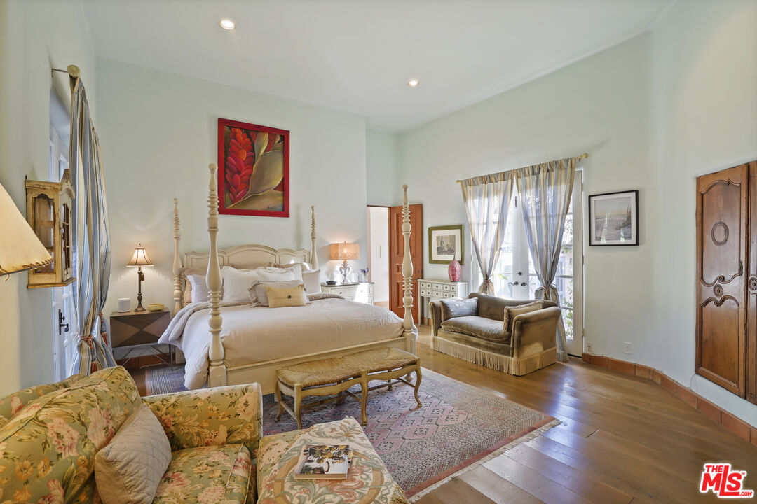 7332 Birdview Avenue Malibu, CA 90265 - Photo 29 of 71 a bedroom with furniture and a wooden floor