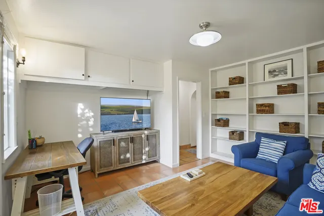 a kitchen with stainless steel appliances granite countertop a stove a refrigerator and a sink