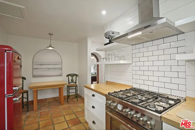 a bedroom with a bed couch and window