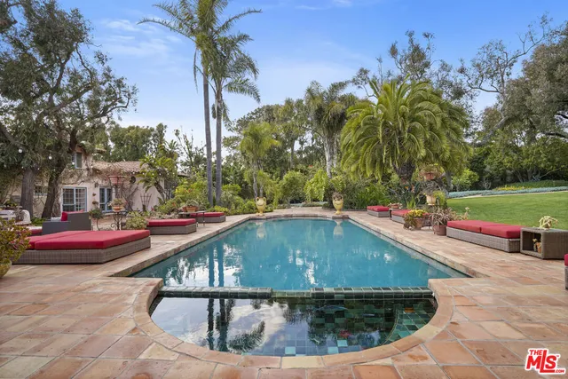a view of a swimming pool with a patio