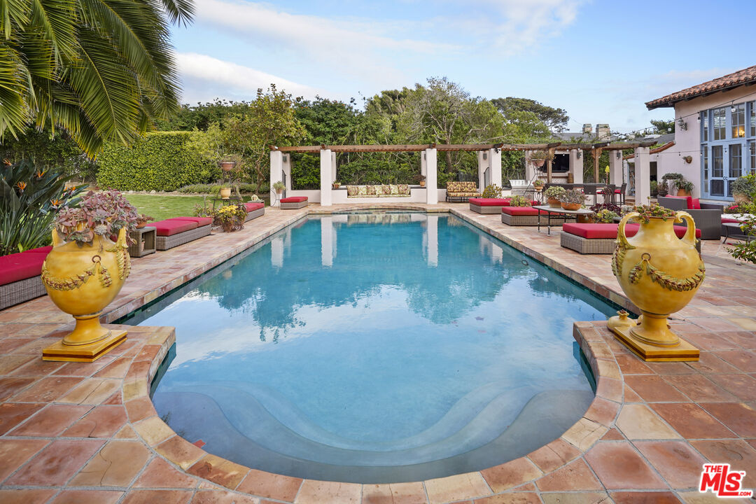 7332 Birdview Avenue Malibu, CA 90265 - Photo 48 of 71 a view of a swimming pool with a patio