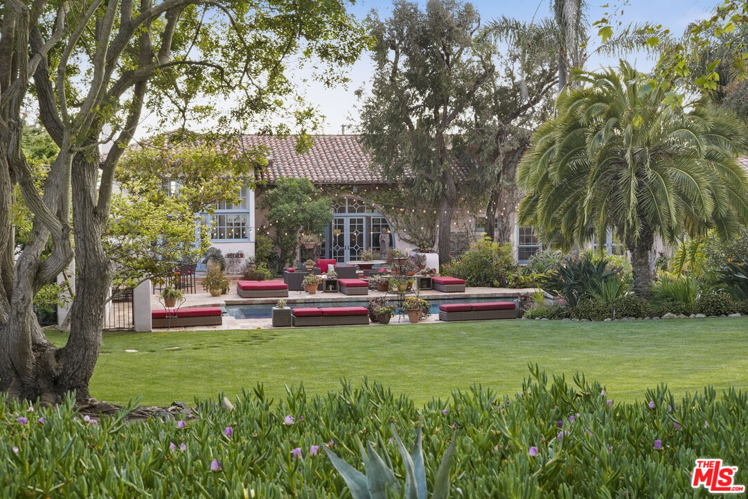 7332 Birdview Avenue Malibu, CA 90265 - Photo 50 of 71 a view of back yard of house with outdoor seating and green space