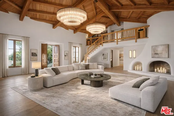 a living room with stainless steel appliances granite countertop a stove and a refrigerator