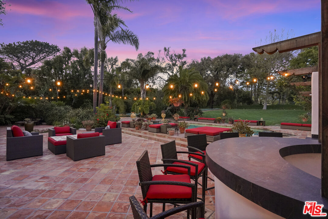 7332 Birdview Avenue Malibu, CA 90265 - Photo 58 of 71 a view of a backyard with sitting area and furniture