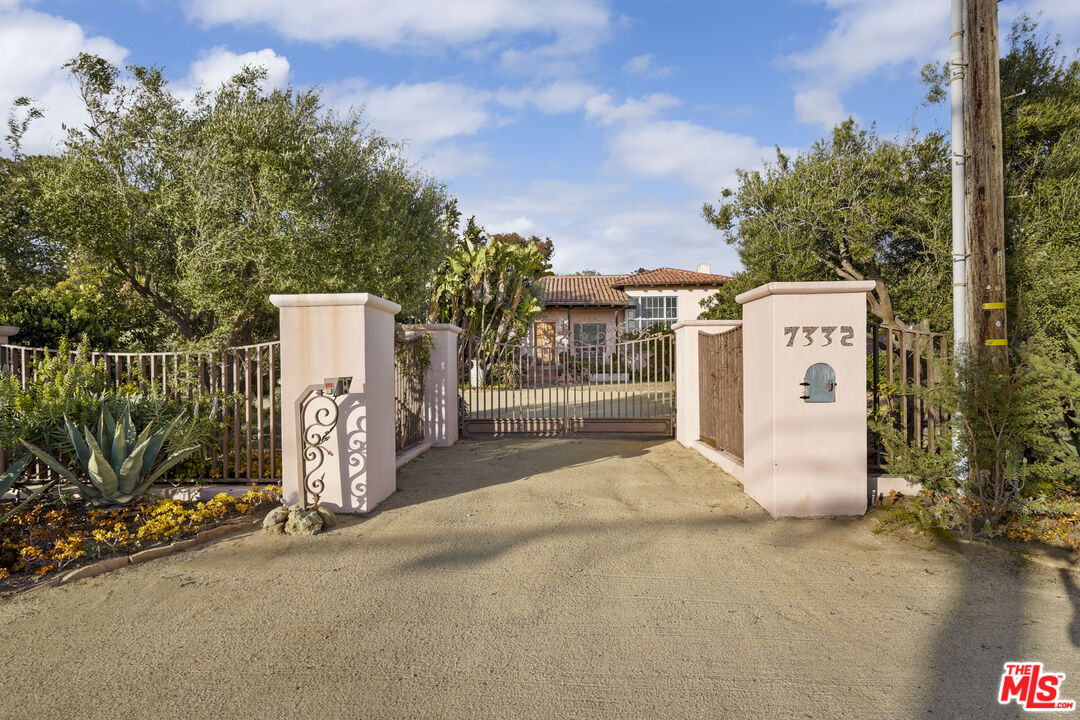 7332 Birdview Avenue Malibu, CA 90265 - Photo 6 of 71 a white house that has tree in front of it