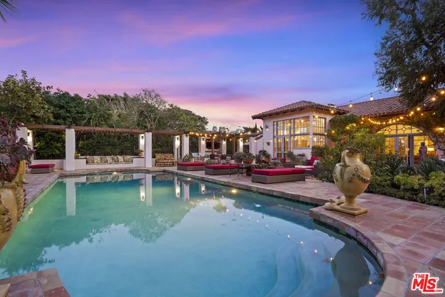 a view of a town with mountains in the background