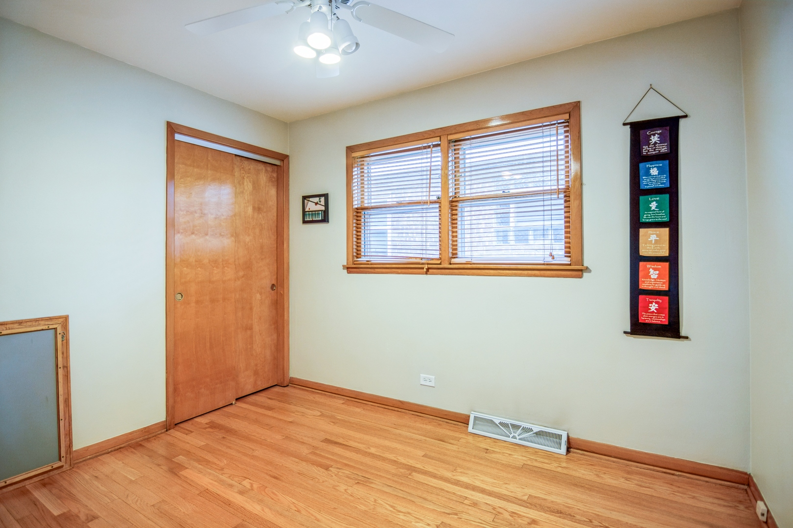 4624 West Addison Street Chicago, IL 60641 - Photo 8 of 14 an empty room with wooden floor and windows