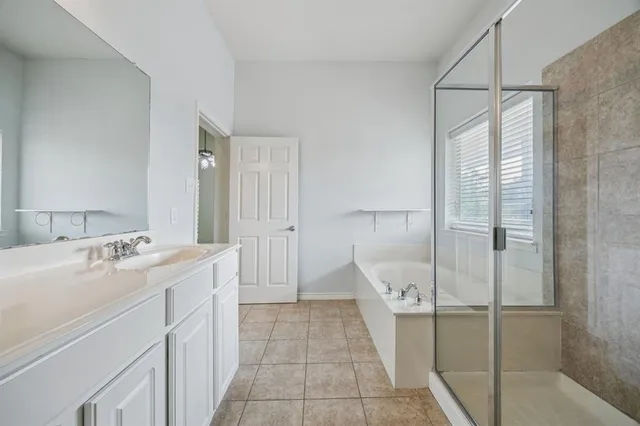 a bathroom with a sink and mirror