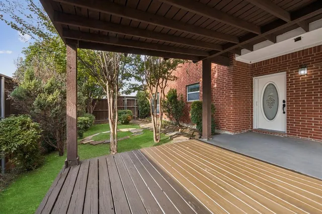 a view of a room with wooden floor and roof