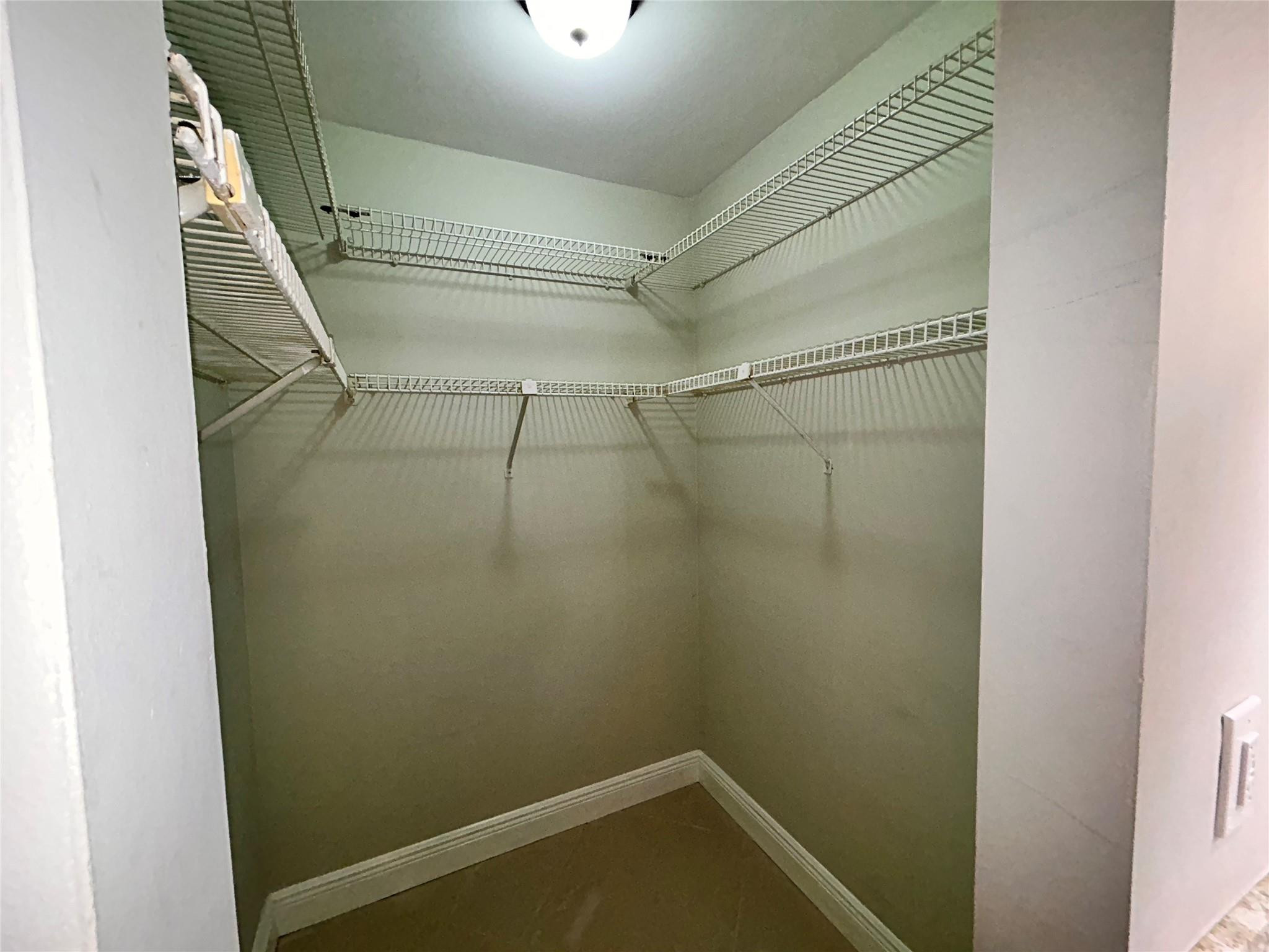 3233 Riverside Drive, Unit C504 Coral Springs, FL 33065 - Photo 22 of 38 walk in closest