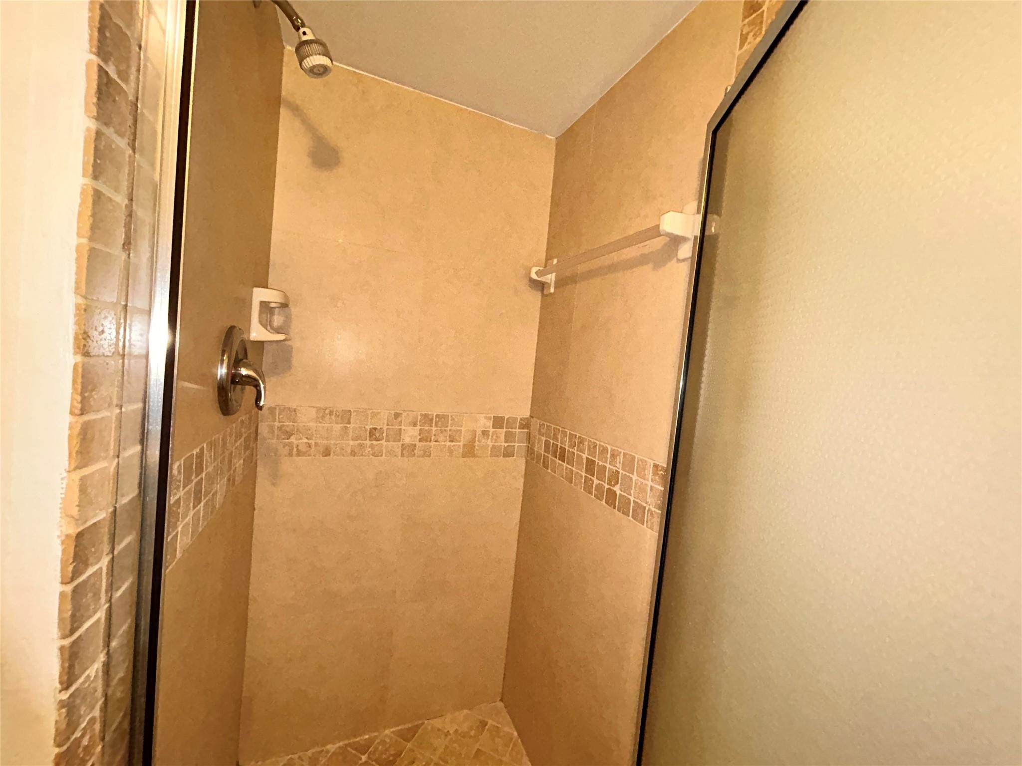 3233 Riverside Drive, Unit C504 Coral Springs, FL 33065 - Photo 26 of 38 Updated shower tile