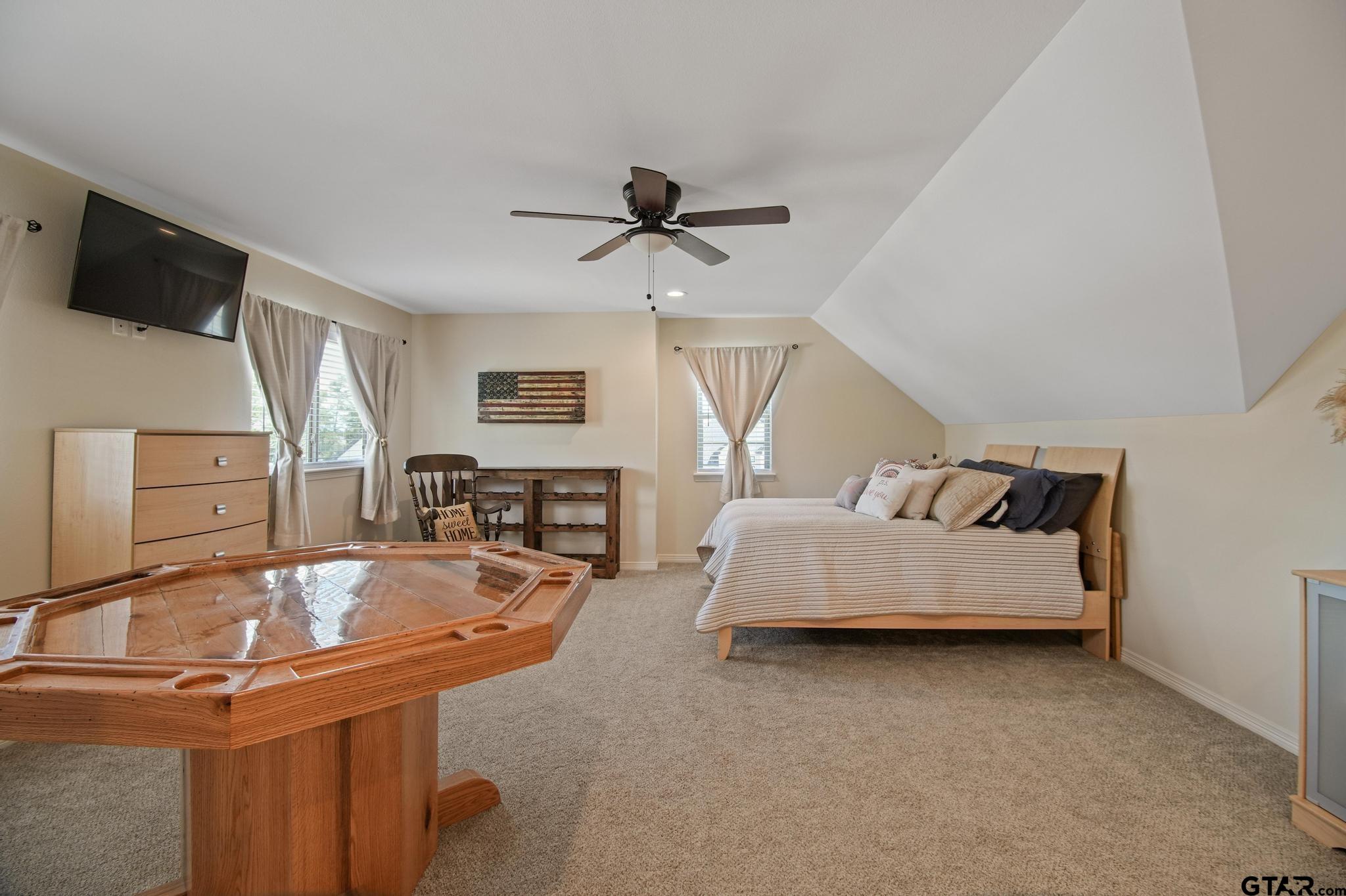 109 Nathan Road Chandler, TX 75758 - Photo 29 of 48 a spacious bedroom with a bed and a flat screen tv
