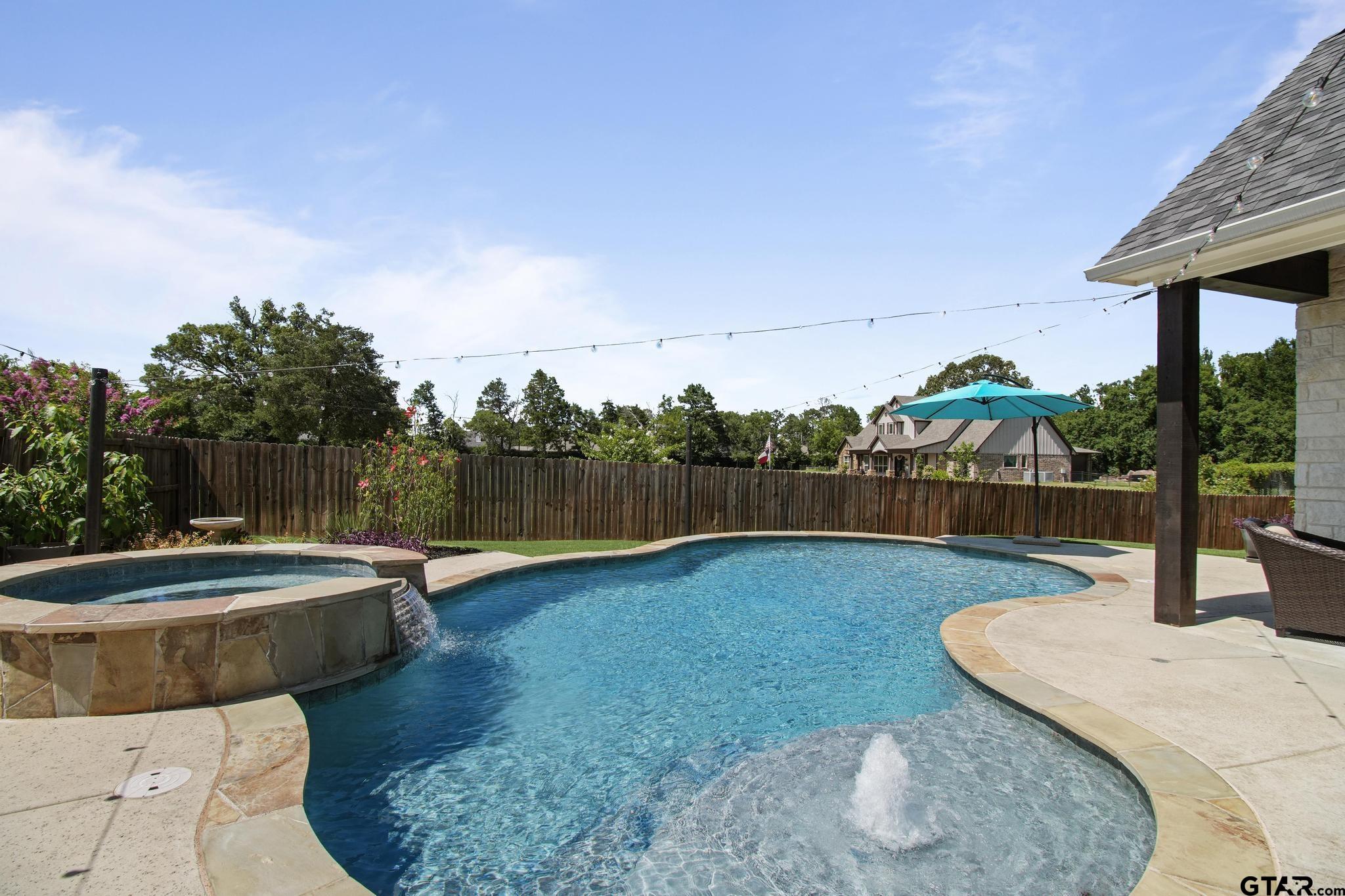 109 Nathan Road Chandler, TX 75758 - Photo 3 of 48 a view of a swimming pool with a patio and a yard