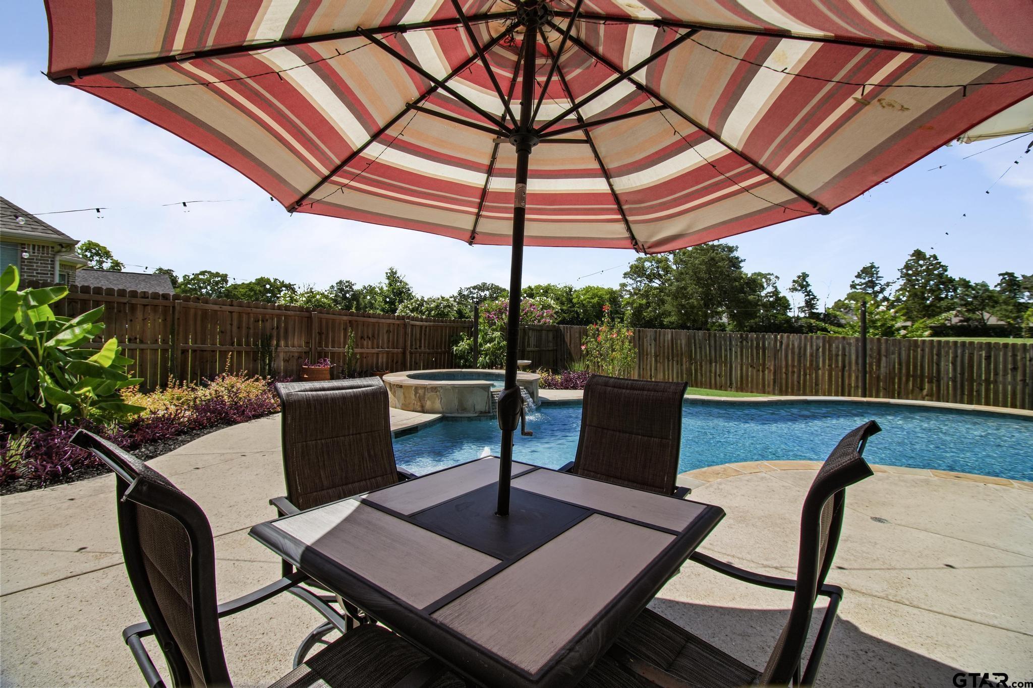 109 Nathan Road Chandler, TX 75758 - Photo 33 of 48 a view of a patio with a table and chairs