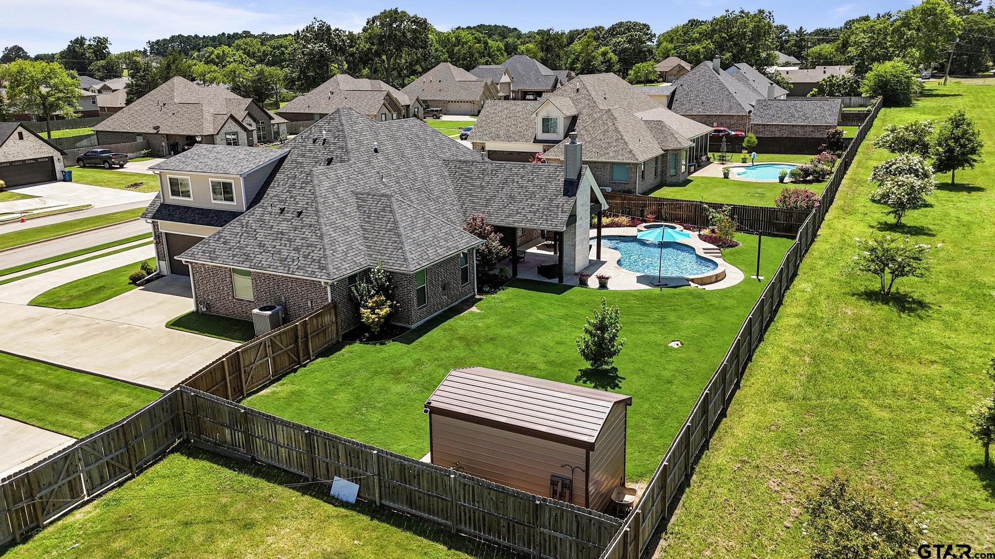 109 Nathan Road Chandler, TX 75758 - Photo 39 of 48 an aerial view of multiple houses with a big yard