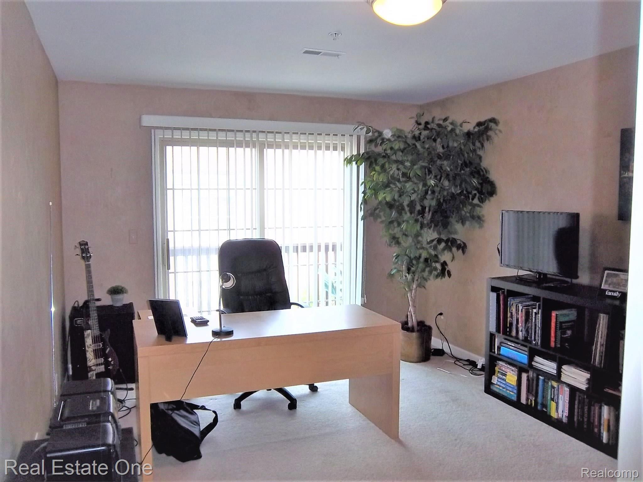 16802 Farmington Road Livonia, MI 48154 - Photo 11 of 23 FAMILY ROOM/OFFICE WITH DOOR WALL TO DECK