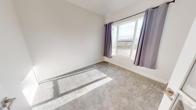 5502 North Valley View Road Lehi, UT 84048 - Photo 17 of 33 Room with light gray carpet flooring and white baseboards