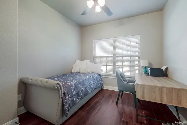 a bedroom with a bed and a table in it