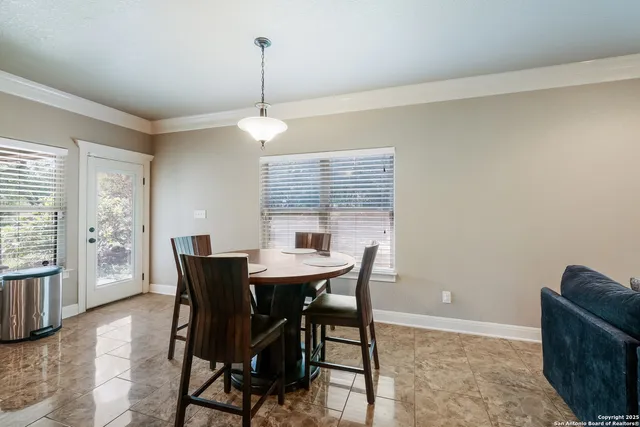 a view of a dining room with furniture window and outside view