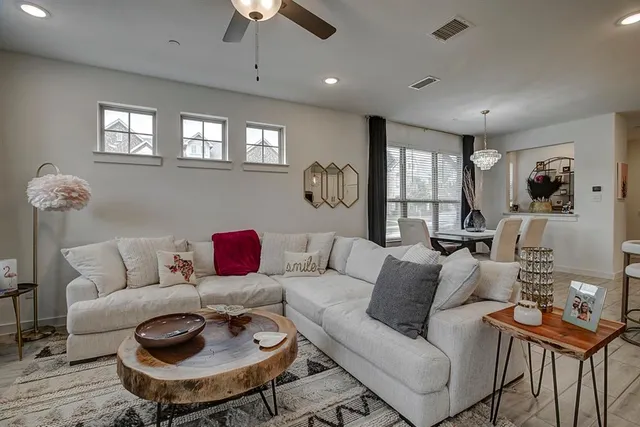 a living room with furniture and a table