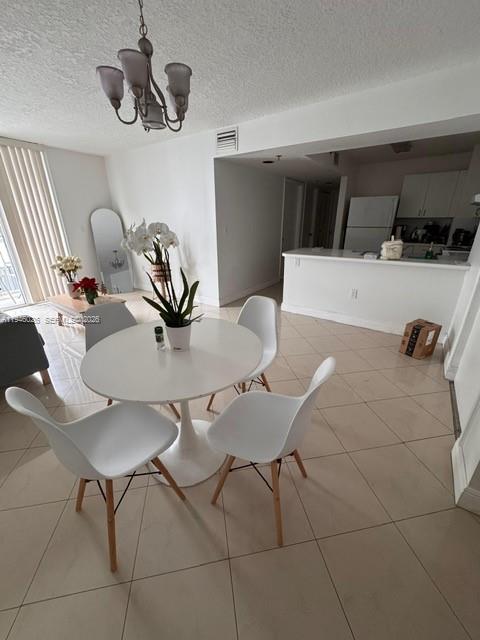 104 Southwest 9th Street, Unit 1403 Miami, FL 33130 - Photo 6 of 11 a view of a dining room with furniture and wooden floor