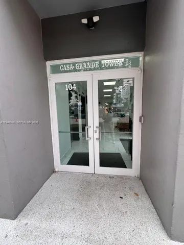 a view of a hallway with a glass door