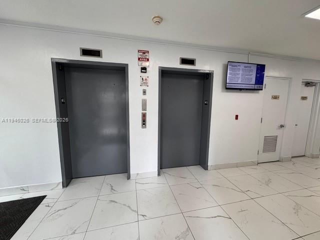 104 Southwest 9th Street, Unit 1403 Miami, FL 33130 - Photo 10 of 11 a view of a hallway with closet