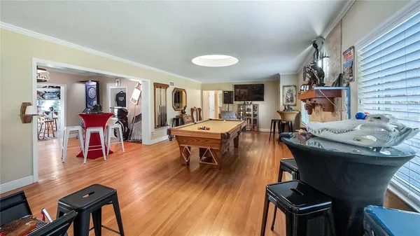 a view of a livingroom with furniture and a wooden floor