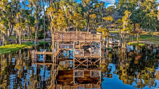 a bedroom with furniture and wooden floor