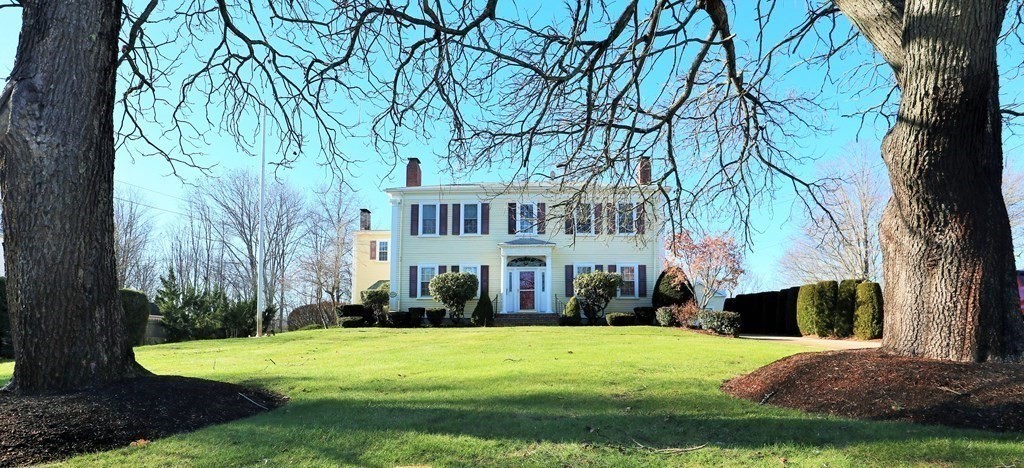 38 Pleasant Street Whitman, MA 02382 - Photo 1 of 21 a view of a house with a yard and a garden